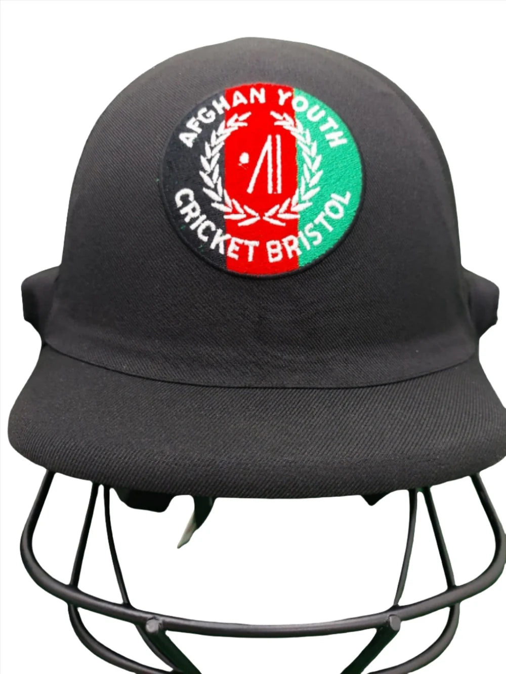 The Custom Shrey Cricket Helmets with Club Logo by Shrey feature a black design with a circular Afghan Youth Cricket Bristol badge, red and green club logo, and laurel wreath—ideal for personalized embroidered helmets.