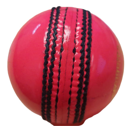 The Dukes Special Crown Cricket Ball (Pink, Senior) from Dukes is made of English leather in vibrant pink, featuring prominent black stitching and detailed seams, displayed on a white background.