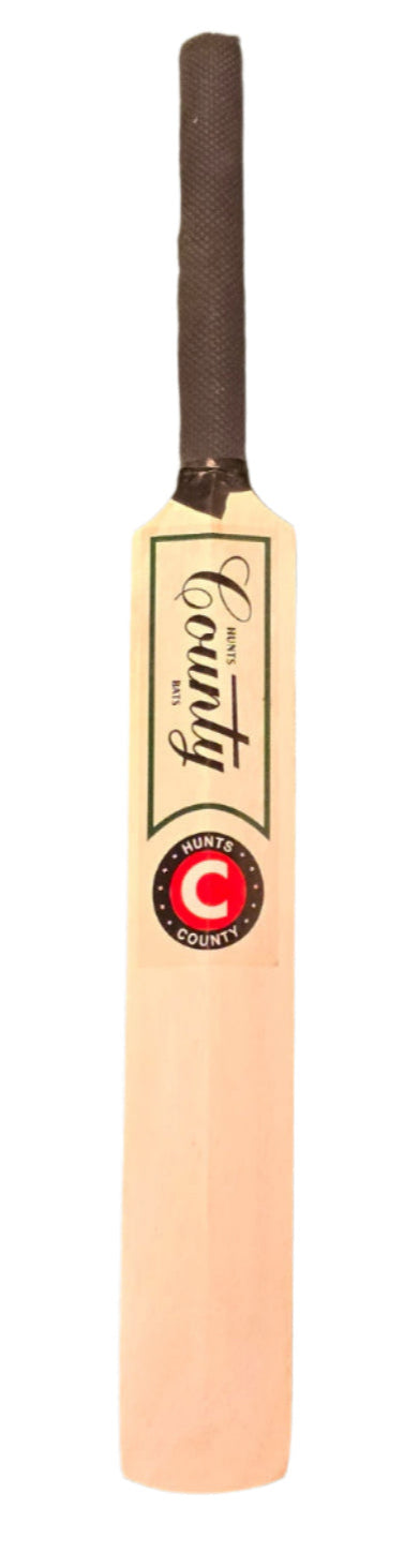 The Hunts County Miniature Cricket Bat features a black handle grip and prominent Hunts County branding, making it perfect for collecting signatures or autographs.
