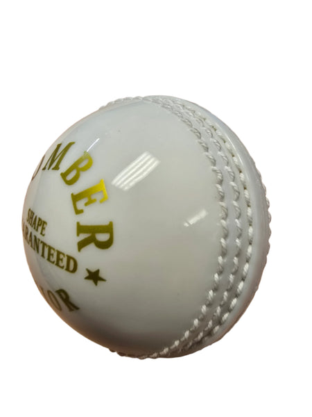A close-up of the white Hunts County Bomber Ball by Hunts County, featuring prominent stitched seams and partial yellow text on a white background—perfect for skill development with cricket training balls.