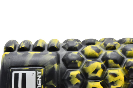 Close-up of the Urban Fitness Massage Roller 33 x 14cm in black and yellow with textured hexagonal and ridged patterns. Perfect for muscle recovery and core exercises. Urban Fitness logo visible on the left side against a white background.