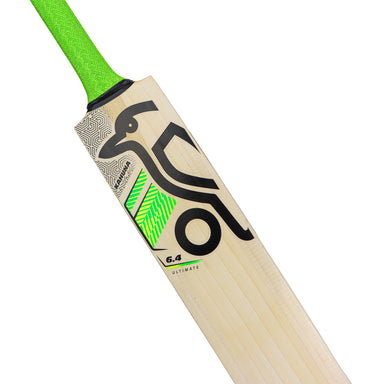 A close-up of the Kookaburra Kahuna 6.4 Ultimate Cricket Bat 2026 by Kookaburra, showcasing a green handle, Pro Shield face, and graphic designs with a black kangaroo and green geometric patterns on English Willow wood.