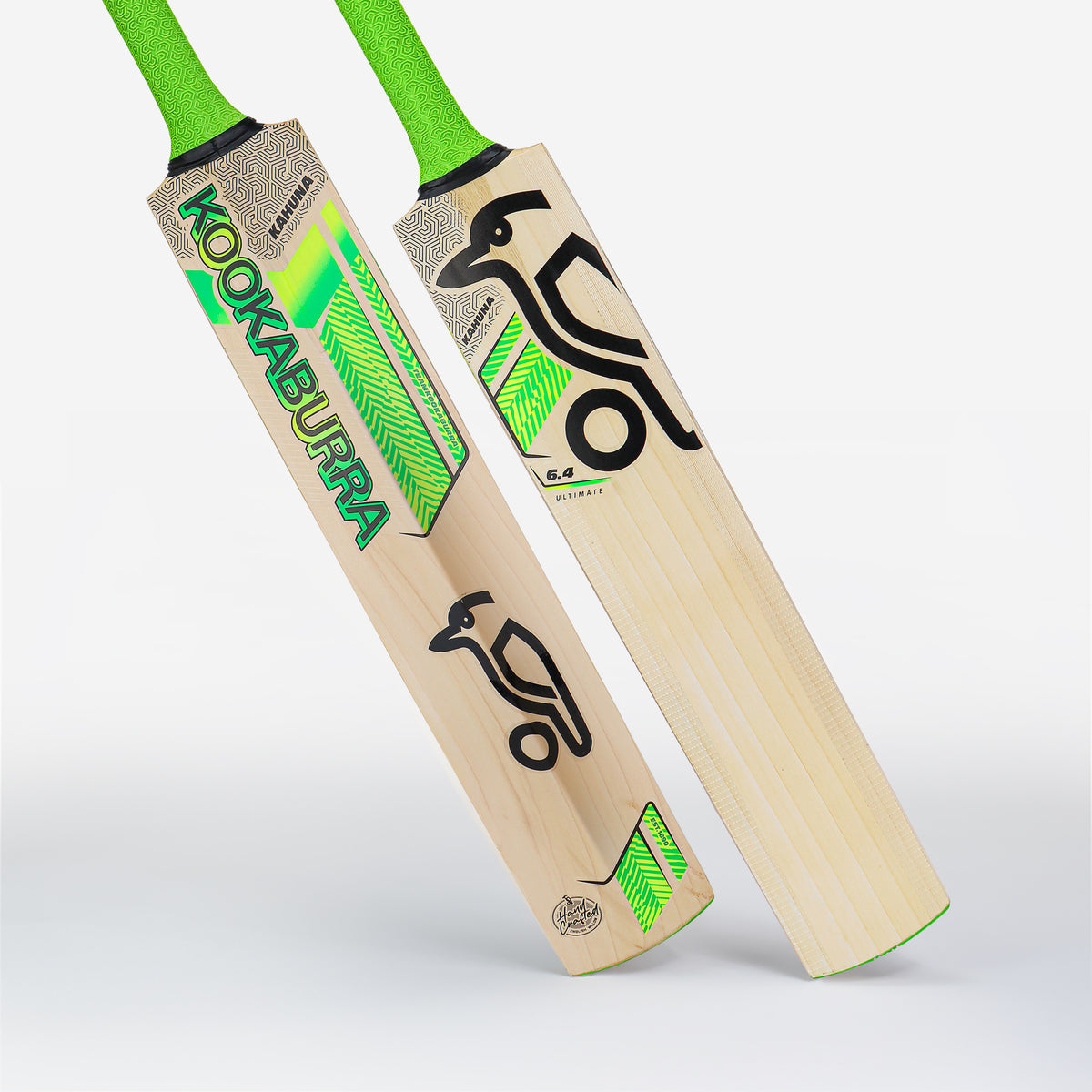 Two Kookaburra Kahuna 6.4 Ultimate Cricket Bat 2026 models, featuring green handles and striking black and green branding, stand upright to display the front and back designs against a plain white background.