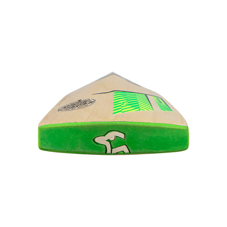 A Kookaburra Kahuna Lite Cricket Bat 2026 by Kookaburra is shown from the toe end, featuring a green edge, logo, and patterned green and black decals on light English Willow. The bat is set against a white background.