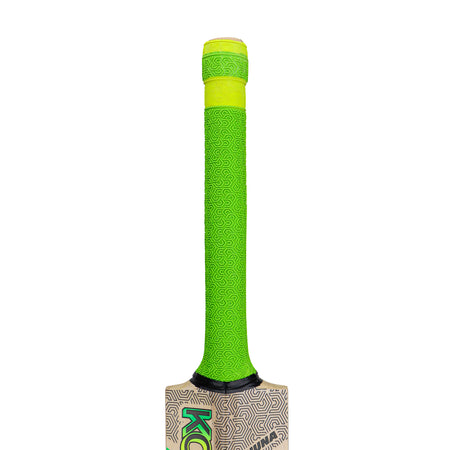 The Kookaburra Big Kahuna Cricket Bat 2026 features a bright green handle with a subtle swirl pattern, capped by a yellow rubber grip. The top of the English Willow blade displays printed designs and is partially visible at the bat’s bottom.
