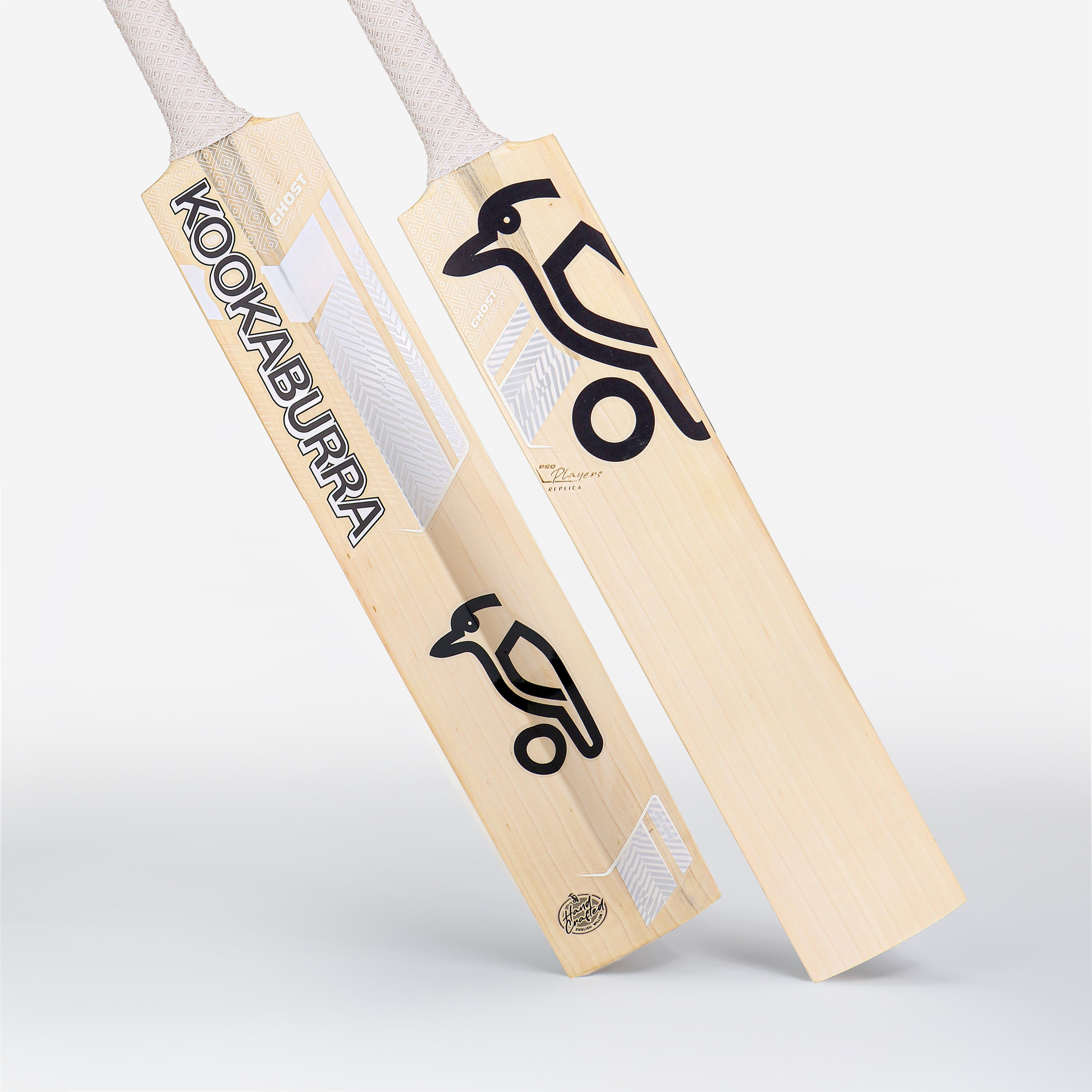 Two Kookaburra Ghost Marnus Labuschagne Pro Players Replica Cricket Bats 2026 are displayed with a light wood finish, black and silver branding, a bird logo on the front, and white grip tape on the handles.