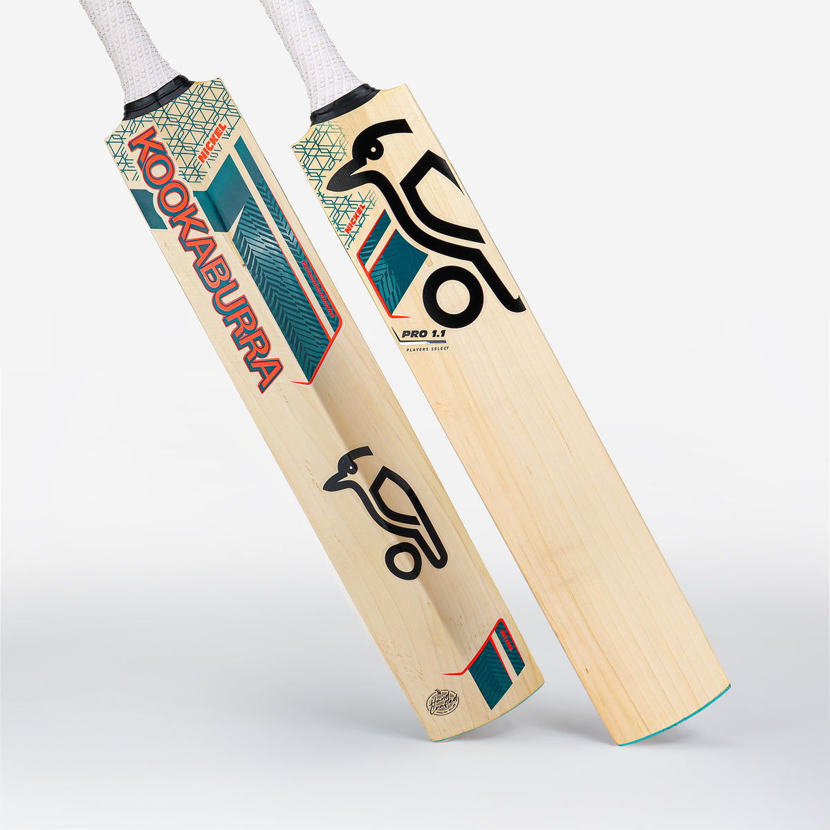 Two Kookaburra Nickel Pro 1.1 Players Select Junior Cricket Bats (2026) feature teal, red, and black accents, white handles, light English willow wood, plus the Kookaburra name and bird logo.
