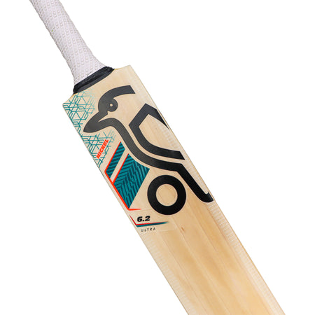 A close-up of the Kookaburra Nickel 6.2 Ultra Cricket Bat 2026, an English Willow bat from Kookaburra with a white textured grip and modern geometric graphics, including a stylized bird and bold black lines on the blade.