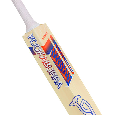 A close-up of the lightweight Kookaburra Rapid 6.5 Force Cricket Bat 2026 featuring a white handle, vibrant red and blue design, and the iconic Kookaburra logo with bird graphic on the blade.