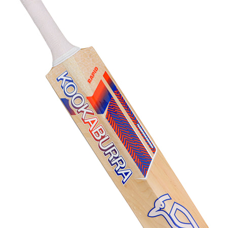 A close-up of the Kookaburra Rapid 6.3 Select Cricket Bat 2026 shows its white grip, light wood blade, and striking red, blue, and white Kookaburra branding—ideal as a youth cricket bat for aspiring players.