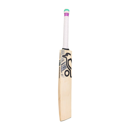 A Kookaburra Prism 6.1 Special Cricket Bat 2026 by Kookaburra, with a white grip and purple, green, and pink tape at the top, features a black and gray geometric blade design. Photographed on a plain white background.