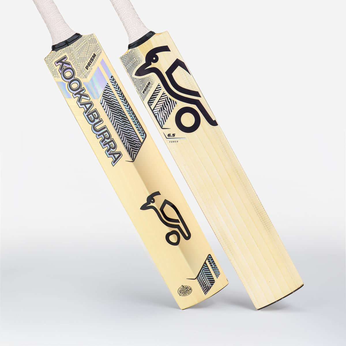 Two Kookaburra Prism 6.5 Force Junior Cricket Bats 2026 stand upright, showing the front and back. These light English Willow bats feature black and blue designs with the signature Kookaburra bird logo.