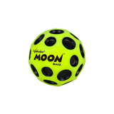 A bright yellow Waboba Original Moon Ball with black circular holes and the Waboba logo, set against a white background. This gravity-defying ball can bounce up to 30 meters high.
