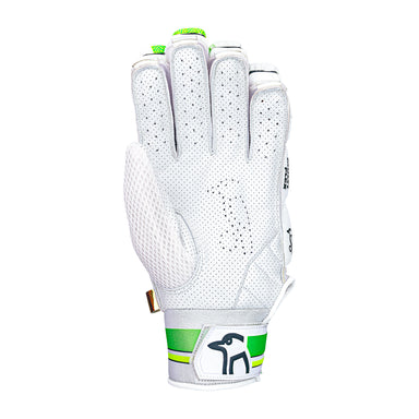 The Kookaburra Kahuna Pro Batting Gloves 2026 by Kookaburra feature a white design with green accents, perforated ventilation, a dog logo on the wrist strap, and a premium sheep leather palm, shown with the palm facing down.