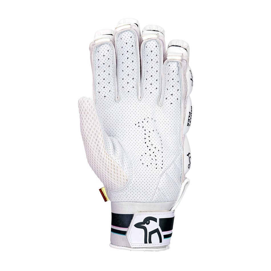 The Kookaburra Prism Pro Batting Gloves 2026 are white with perforated details, black/green wrist strap accents, and a black bird logo. Mesh ventilation on the palm adds comfort and pro-level impact protection.