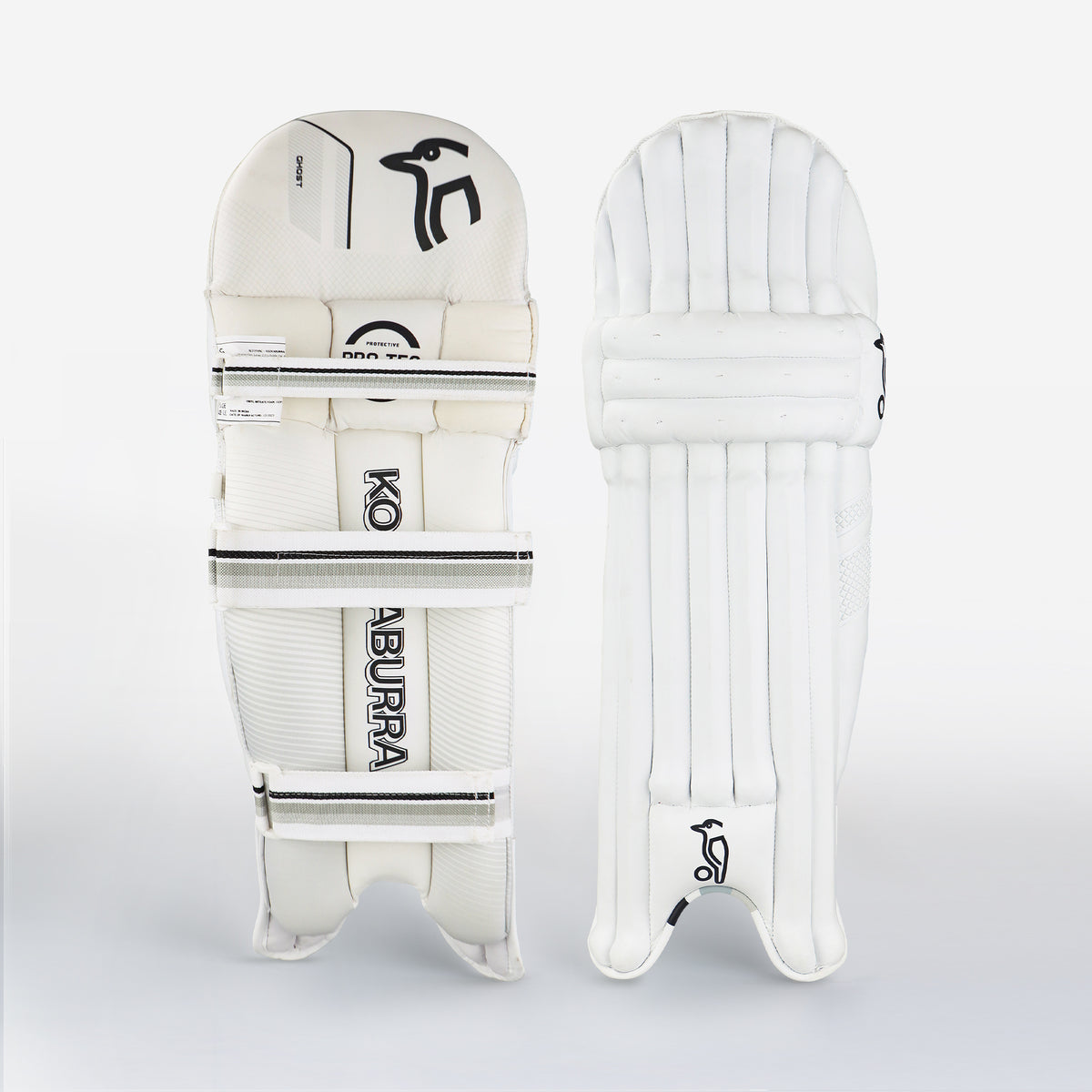 Two white Kookaburra Ghost 5.1 Batting Pads 2026 stand upright against a plain background, showing vertical padding in front and branded straps at the back—classic features of Kookaburra’s protective cricket gear.