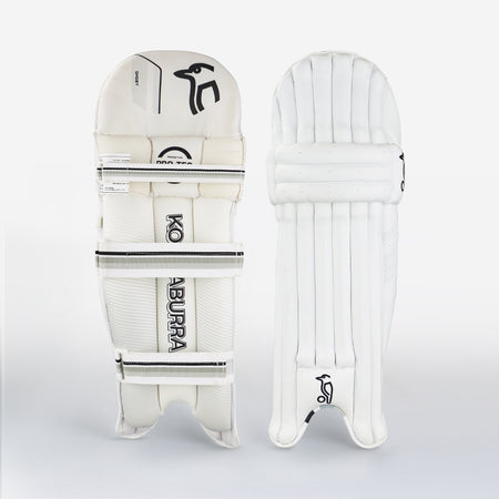 Two white Kookaburra Ghost 5.1 Batting Pads 2026 stand upright against a plain background, showing vertical padding in front and branded straps at the back—classic features of Kookaburra’s protective cricket gear.