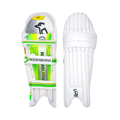 Two white Kookaburra Kahuna Pro Batting Pads 2026 from Kookaburra, with green and yellow accents and advanced impact protection; one displays the front padding, the other showcases back straps and the brand’s iconic logo.