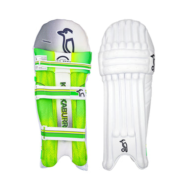 Two white Kookaburra Kahuna 3.1 Batting Pads 2026: one shows the inner side with green/yellow straps, mesh, and KABURR branding; the other displays the smooth, ribbed outer surface featuring a black logo and Grade 3 protection.