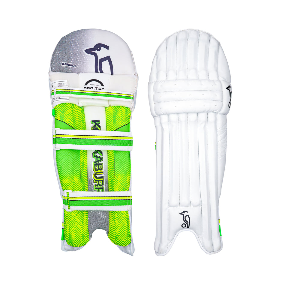 Two white Kookaburra Kahuna 5.1 Batting Pads 2026 are shown side by side: one displays green and yellow straps and inner branding, while the other shows the plain padded front, ideal protection for young cricketers.