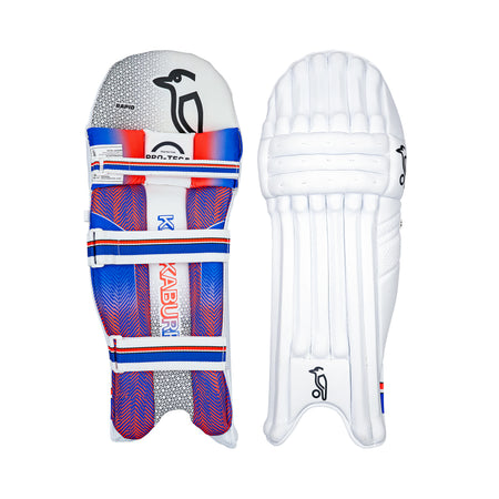 Two cricket batting pads are shown: on the left, the Kookaburra Rapid 4.1 Batting Pads 2026 by Kookaburra with a vibrant blue, red, and white design; on the right, a plain white pad with curved padding and subtle branding.