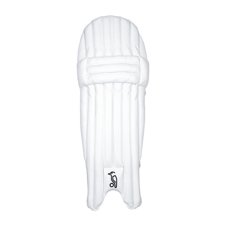 The Kookaburra Rapid 6.1 Batting Pads 2026 by Kookaburra feature vertical padding lines, detailed stitching, and a black logo near the bottom—lightweight and ideal entry-level cricket pads, shown here in white on a plain background.
