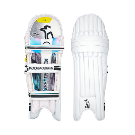 Two white Kookaburra Prism Pro Batting Pads 2026 are shown side by side: the left displays the inner side with colorful, Kookaburra-branded straps, while the right shows the plain, ribbed outer surface of these premium pads.