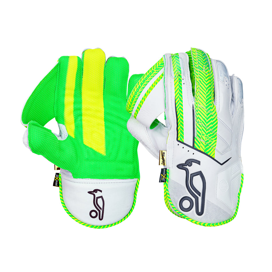 The Kookaburra SC Pro Wicket Keeping Gloves 2026 feature green and yellow mesh backs, white palms, neon green details, a black penguin logo, and premium sheep leather for comfort.