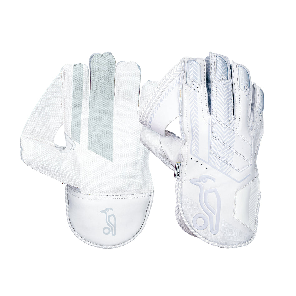 The Kookaburra SC 1.1 Wicket Keeping Gloves 2026 feature white and light grey design, textured aniline sheep leather palms, reinforced fingertips, mesh ventilation, and a stylized bird logo on the wrist.