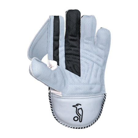 The Kookaburra SC 2.1 Wicket Keeping Gloves 2026 by Kookaburra are light gray with black accents, octopus rubber grip, and a penguin logo on the wrist, shown palm side up with the index finger bent inward.