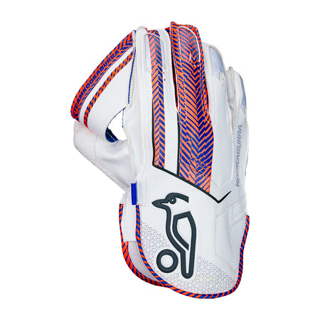 The Kookaburra SC 3.1 Wicket Keeping Gloves 2026 feature white design with blue and red chevrons, black bird logo on the palm, blue/red finger trim, and Octopus Grade 1 rubber for top grip and performance.