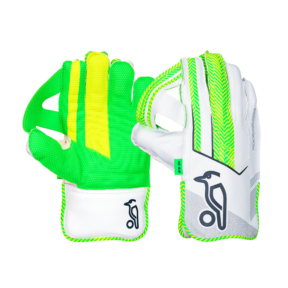 Kookaburra LC 4.0 Wicket Keeping Gloves 2026 for Youth, featuring a green and yellow mesh back on one glove and a white palm with green accents plus the Kookaburra bird logo on the other. Brand: Kookaburra.