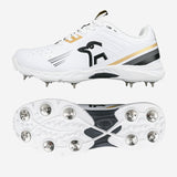 The Kookaburra KC 3.0 Cricket Spikes 2026 by Kookaburra feature a white design with gold and black accents, metal spikes, and a kangaroo logo. Ideal for club players, one shoe is shown from the side and another displays the spike layout.