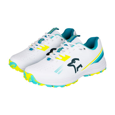 The Kookaburra KC 3.0 Rubber Soled Cricket Shoes 2026 feature white uppers with aqua and yellow accents, teal lining, yellow laces, a black bird logo, and patterned rubber outsoles for synthetic cricket surfaces.