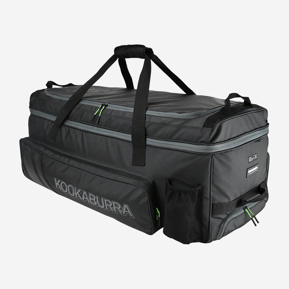 The Kookaburra Pro Players Wheelie 2026 is a spacious black and gray cricket gear bag with brand logo, double decker storage, multiple zippered compartments, handles, and a side pocket—perfect for players.