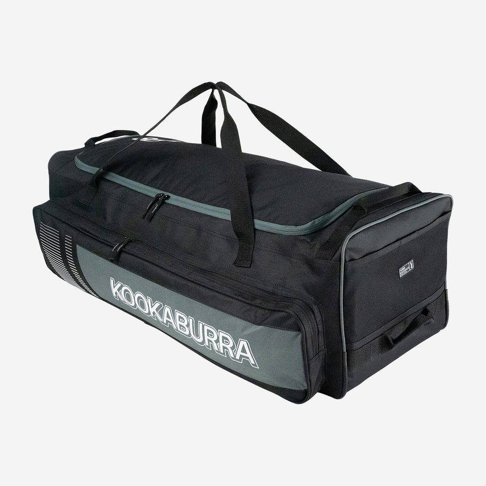 The Kookaburra 4500 Wheelie 2025 cricket bag in black/grey features carrying handles, a side pocket, zippered compartments, large storage capacity, and the Kookaburra logo printed in white on the side.