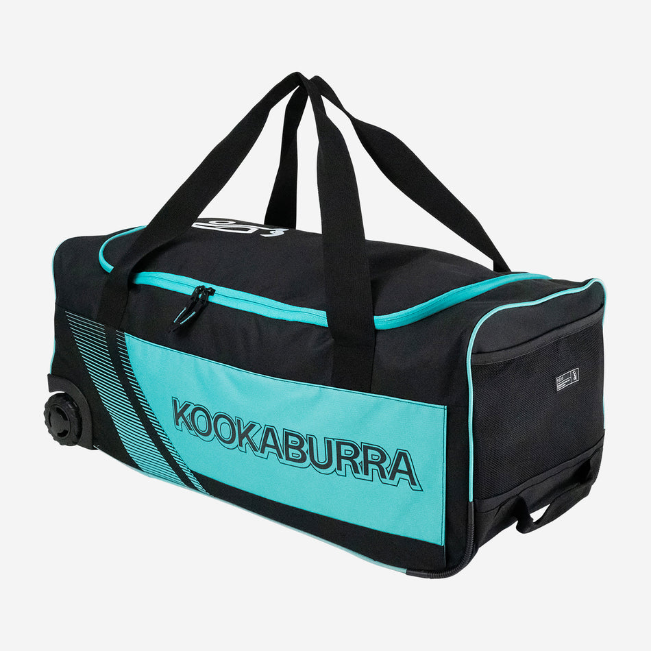 The Kookaburra 9500 Wheelie 2025 in Black/Teal features carrying handles, a zippered main compartment, and the bold Kookaburra logo—ideal as a junior cricket bag.