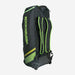 The Kookaburra WD2000 Wheelie Duffle Bag 2025, in black and green with branding, wheels, and backpack straps, stands upright on a white background.