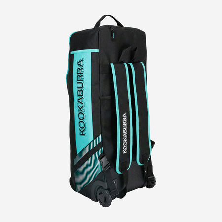 The Kookaburra WD6000 Junior Wheelie Duffle Bag 2026 is a black duffle with teal accents, upright wheels, padded shoulder straps, a top handle, and bold Kookaburra branding—ideal as a cricket bag.
