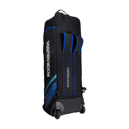 The Kookaburra WD5000 Wheelie Duffle Bag 2026 is a large black bag with blue accents, two wheels, telescopic handle, side pockets, and Kookaburra logo on the side and front—perfect for cricket gear.