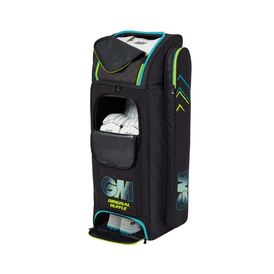 The Gunn & Moore Original Duffle 2025 cricket kit bag, crafted from durable 600-denier polyester with turquoise and yellow accents, features multiple zippered compartments, a bat pocket, and visible white cricket pads in the front pocket.