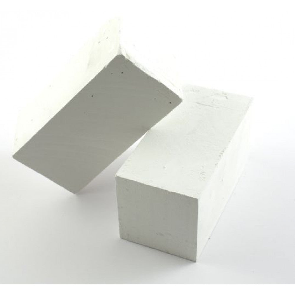 Two white rectangular Playground Chalk Blocks by Martin Berrill Sports are set on a plain white background—one flat and the other leaning diagonally, as if illustrating chalk lines for playground marking.