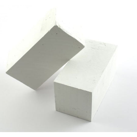 Two white rectangular Playground Chalk Blocks by Martin Berrill Sports are set on a plain white background—one flat and the other leaning diagonally, as if illustrating chalk lines for playground marking.