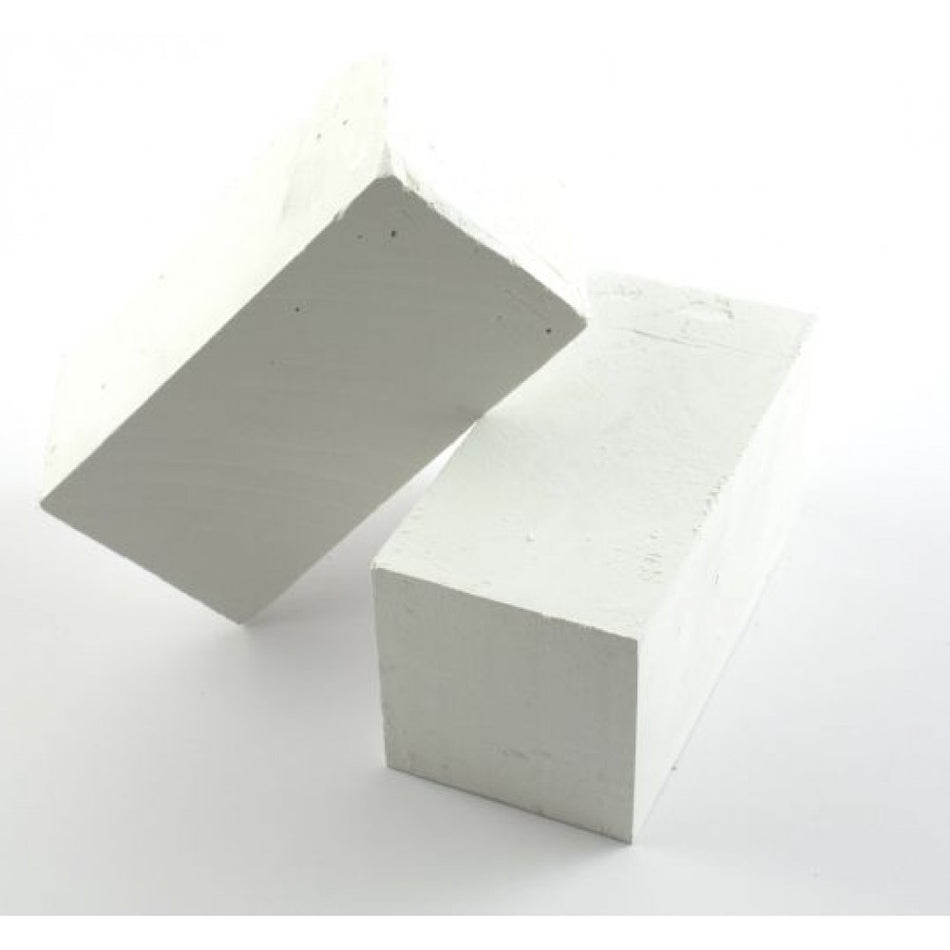 Two white rectangular Playground Chalk Blocks by Martin Berrill Sports are set on a plain white background—one flat and the other leaning diagonally, as if illustrating chalk lines for playground marking.