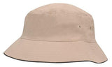 The Martin Berrill Sports Brushed Sports Twill Bucket Hat in Stone/Black features a wide downward brim, side ventilation holes, and offers custom logo options.