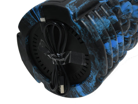 A close-up of the Urban Fitness Vibrating Foam Roller in blue and black shows its circular base with a coiled USB charging cable—ideal for deep tissue massage and muscle recovery from Urban Fitness.