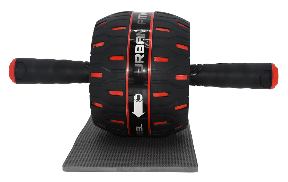 The Urban Fitness Rebound Ab Wheel, in black and red with two handles and a white arrow on the wheel, rests on a small gray mat. Branded by Urban Fitness, it’s ideal for building core strength.