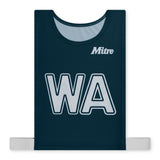 The Mitre Pro Netball Bib set features adult-sized navy bibs made from polyester micro mesh, with "WA" in white and the Mitre logo on the chest. Two white side straps extend from the bottom edges for a secure fit.