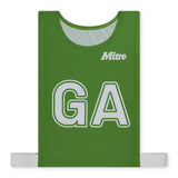 The Mitre Pro Netball Bib set features a green polyester micro mesh bib with bold white "GA" lettering and the Mitre brand name above. Adjustable side straps ensure a secure fit for adults, making it ideal for netball teams.