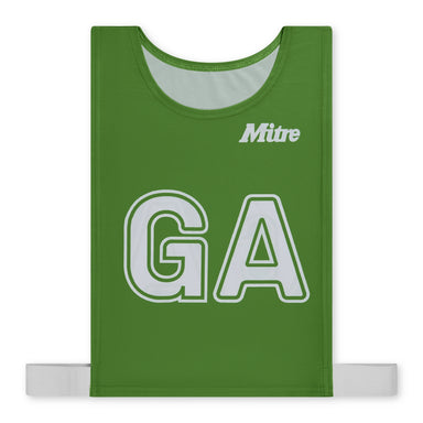 The Mitre Pro Netball Bib set features a green polyester micro mesh bib with bold white "GA" lettering and the Mitre brand name above. Adjustable side straps ensure a secure fit for adults, making it ideal for netball teams.